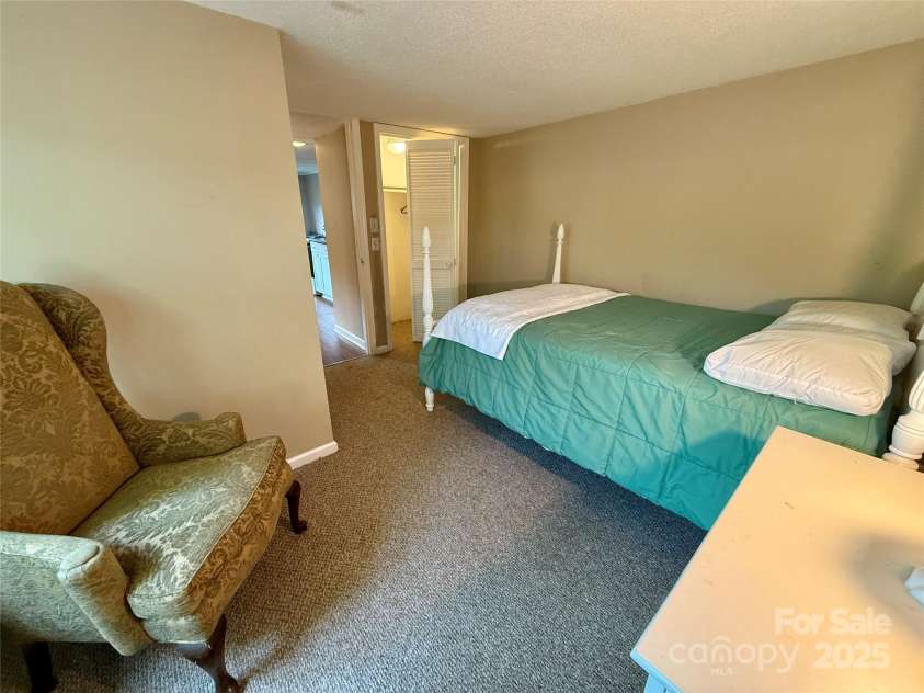 43 Howard Street, Tryon, NC 28782.  MLS# CAR4268057, YatesRealty ID 21234. Cottage bedroom