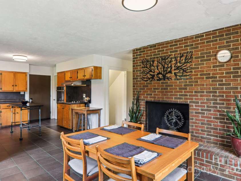 318 & 324 Old Leicester Highway, Asheville, NC 28806.  MLS# CAR4272813, YatesRealty ID 21241. Dining w Cozy Fireplace