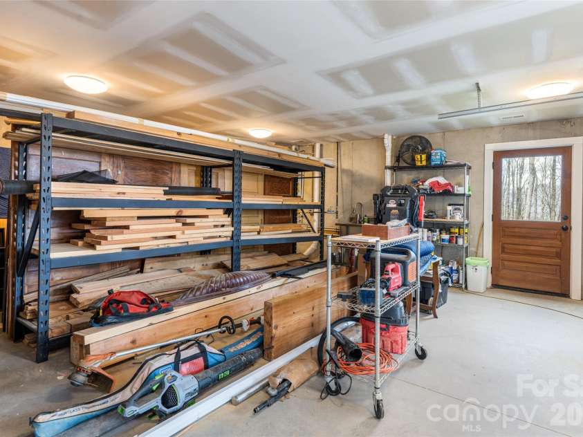 51 Summit Road, Swannanoa, NC 28778.  MLS# CAR4367888, YatesRealty ID 21243. Workshop on lower level of garage