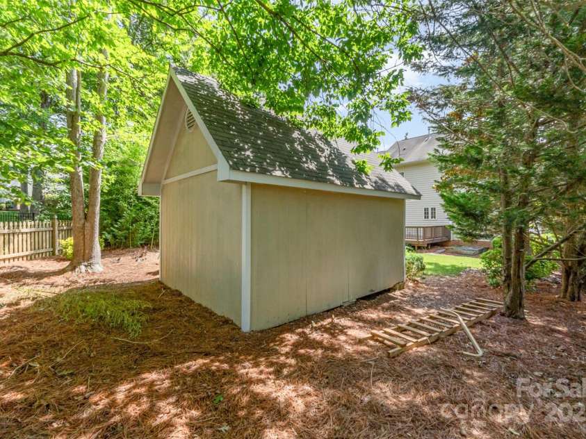 1002 Hollyhedge Lane, Indian Trail, NC 28079.  MLS# CAR4269454, YatesRealty ID 21244. Backyard space behind the shed