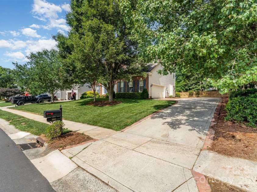 1002 Hollyhedge Lane, Indian Trail, NC 28079.  MLS# CAR4269454, YatesRealty ID 21244. Driveway with side load garage