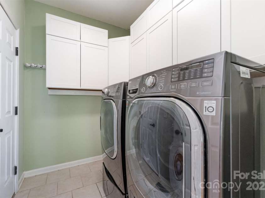 1002 Hollyhedge Lane, Indian Trail, NC 28079.  MLS# CAR4269454, YatesRealty ID 21244. Laundry Room with lots of cabinets for storage