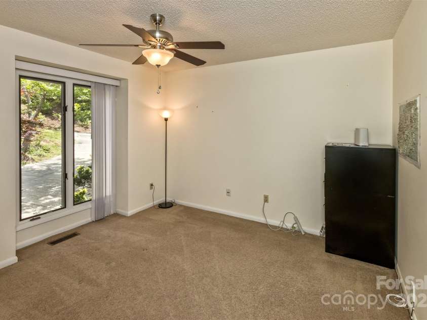 100 Black Oak Drive, Asheville, NC 28804.  MLS# CAR4266222, YatesRealty ID 21246. Bedroom 3 with built-in shelving