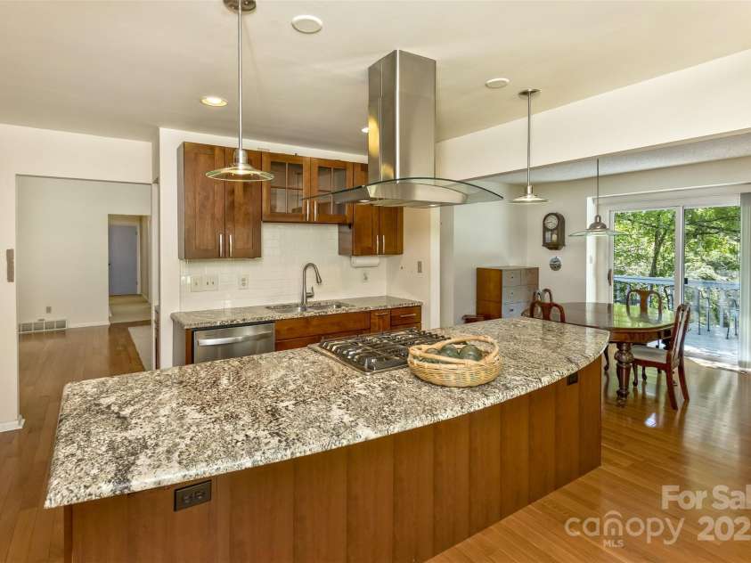 100 Black Oak Drive, Asheville, NC 28804.  MLS# CAR4266222, YatesRealty ID 21246. Island with a breakfast bar.  Modern mounted hood for an open concept
