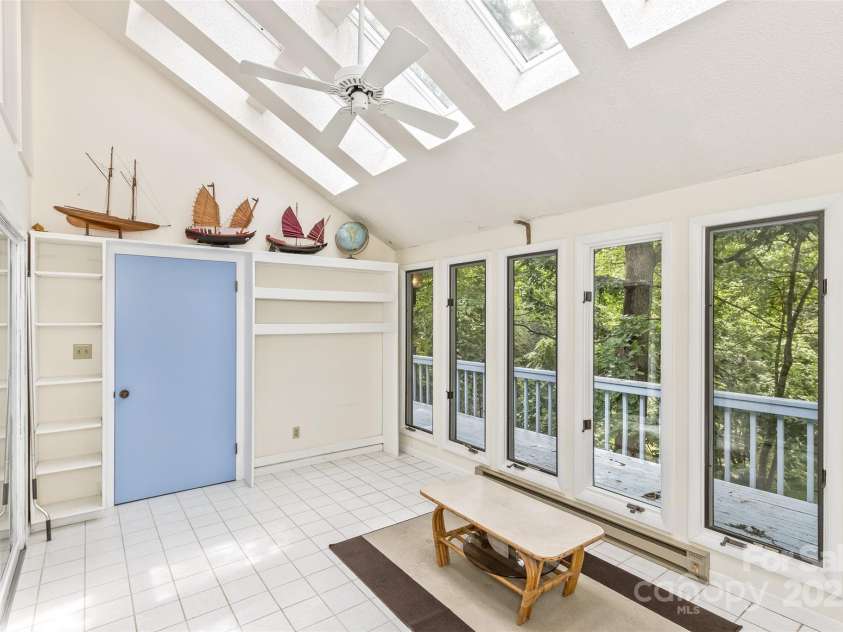 100 Black Oak Drive, Asheville, NC 28804.  MLS# CAR4266222, YatesRealty ID 21246. Sun room enclosed porch with tile floor