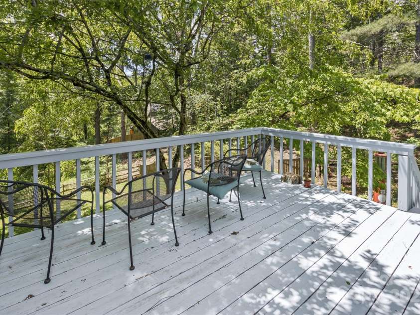 100 Black Oak Drive, Asheville, NC 28804.  MLS# CAR4266222, YatesRealty ID 21246. The private deck nestles up to woods and wildlife