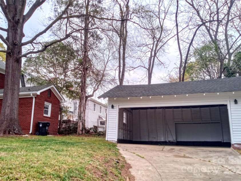 55 Academy Avenue, Concord, NC 28025.  MLS# CAR4220777, YatesRealty ID 21248. Private driveway with two car garage/carport