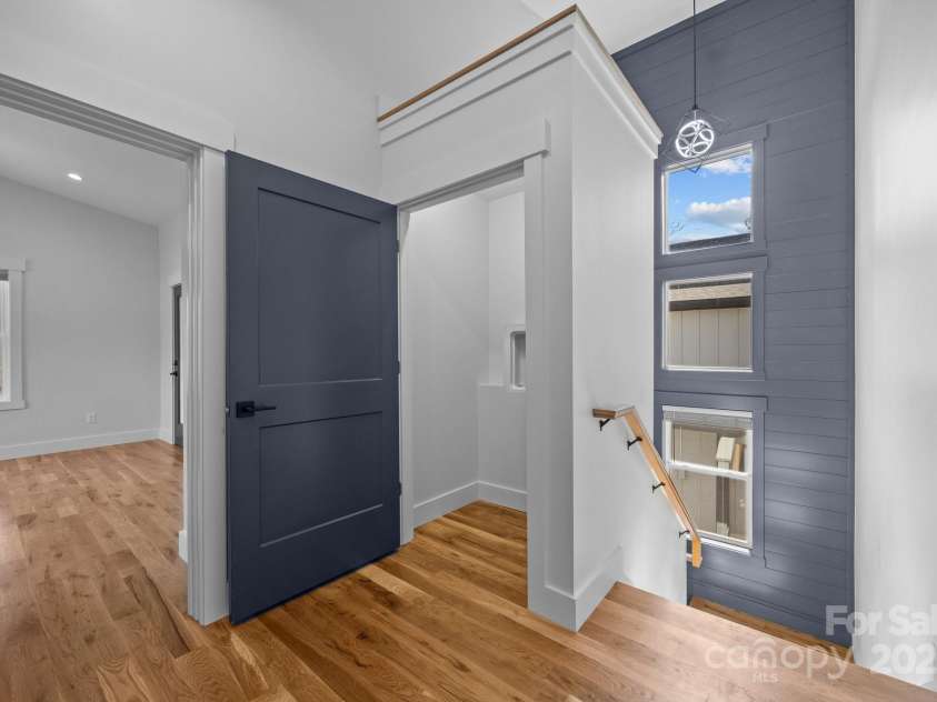 87 Glendale Avenue, Asheville, NC 28803.  MLS# CAR4145550, YatesRealty ID 2125. Notice that accent wall in the stairwell!