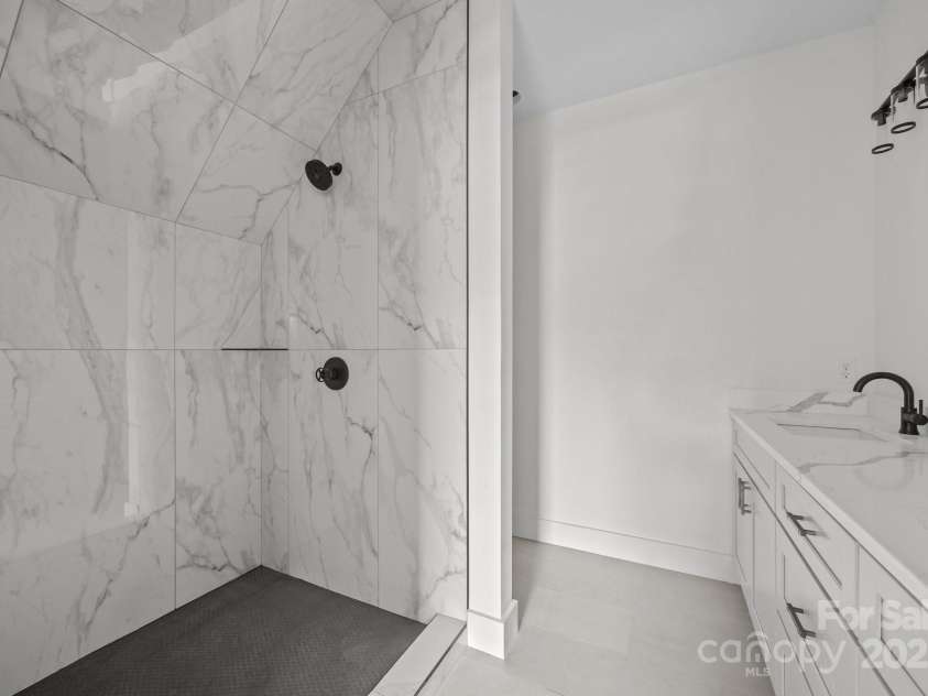 58 Pinedale Road, Asheville, NC 28805.  MLS# CAR4320485, YatesRealty ID 2126. Primary bath walk in shower