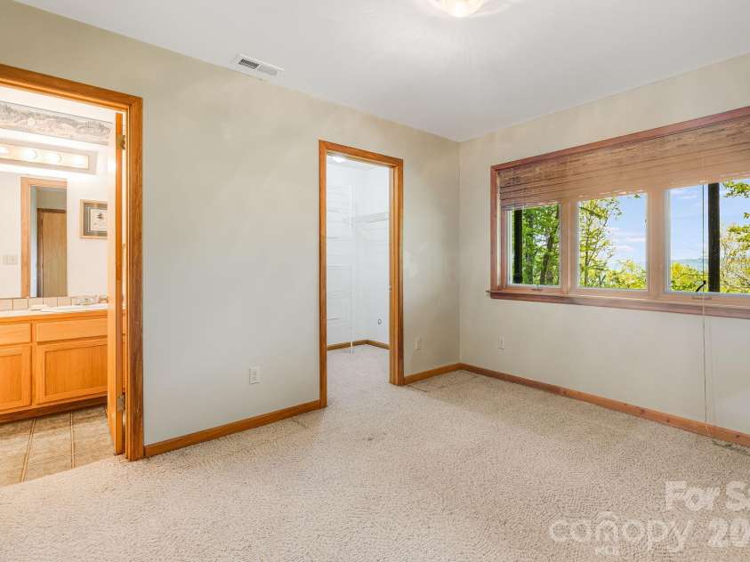 24 Smokey Road, Asheville, NC 28803.  MLS# CAR4371941, YatesRealty ID 21269. Lower lever bedroom
