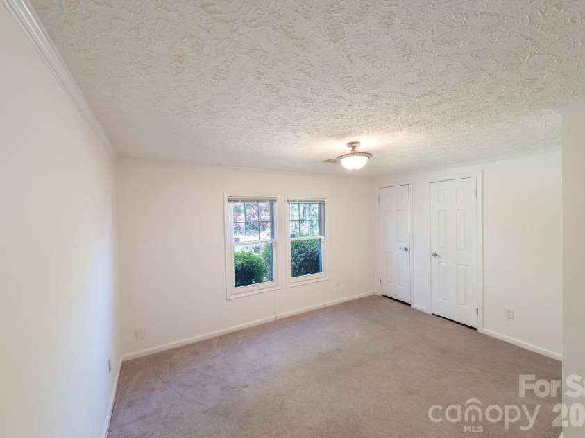 132 Serenity Circle, Hendersonville, NC 28792.  MLS# CAR4378442, YatesRealty ID 21270. BEDROOM 2 ON THE MAIN LEVEL WITH DOUBLE CLOSETS