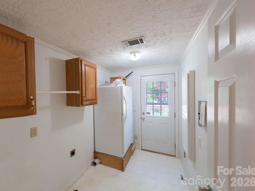 132 Serenity Circle, Hendersonville, NC 28792.  MLS# CAR4378442, YatesRealty ID 21270. LAUNDRY MAIN LEVEL - EXIT DOOR TO BACKYARD