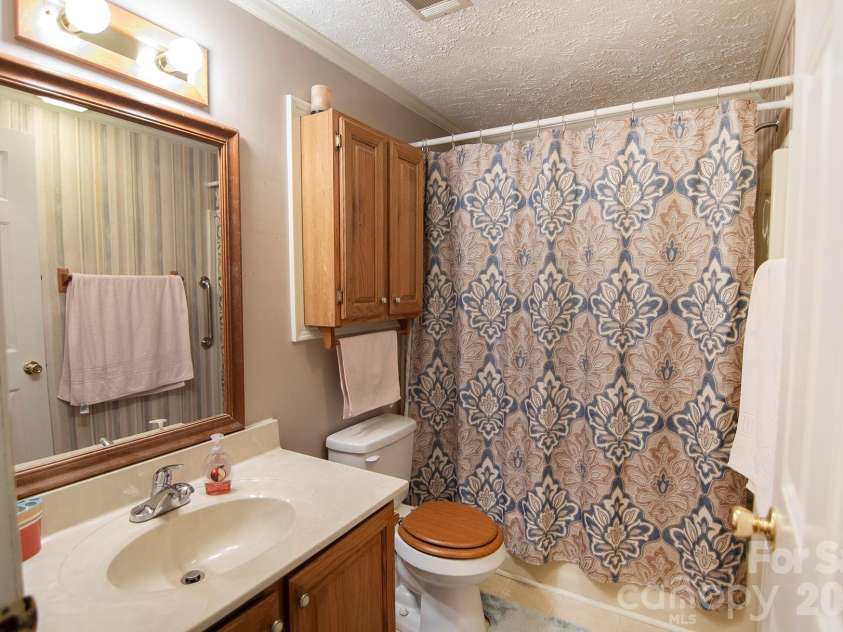 132 Serenity Circle, Hendersonville, NC 28792.  MLS# CAR4378442, YatesRealty ID 21270. Main Level Guest Bathroom