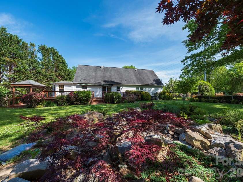 132 Serenity Circle, Hendersonville, NC 28792.  MLS# CAR4378442, YatesRealty ID 21270. YOUR OWN PRIVATE POND W WATERFALL