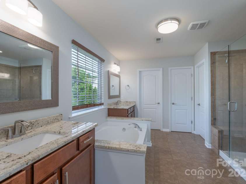 1211 Gold Rush Court, Fort Mill, SC 29708.  MLS# CAR4264284, YatesRealty ID 21275. Primary ensuite with dual closets