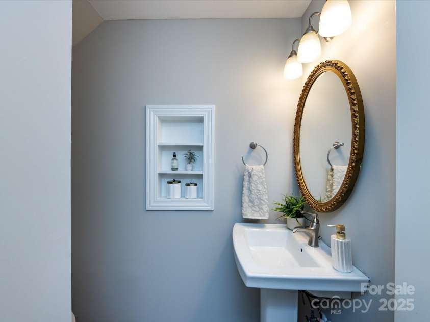 1708 Roxborough Road, Charlotte, NC 28211.  MLS# CAR4271759, YatesRealty ID 21279. Powder room with wall storage and medicine cabinet