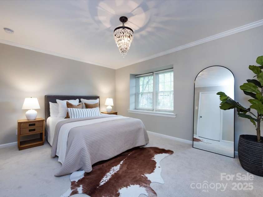 1708 Roxborough Road, Charlotte, NC 28211.  MLS# CAR4271759, YatesRealty ID 21279. Second bedroom is just as large as the primary and features a beautiful light fixture