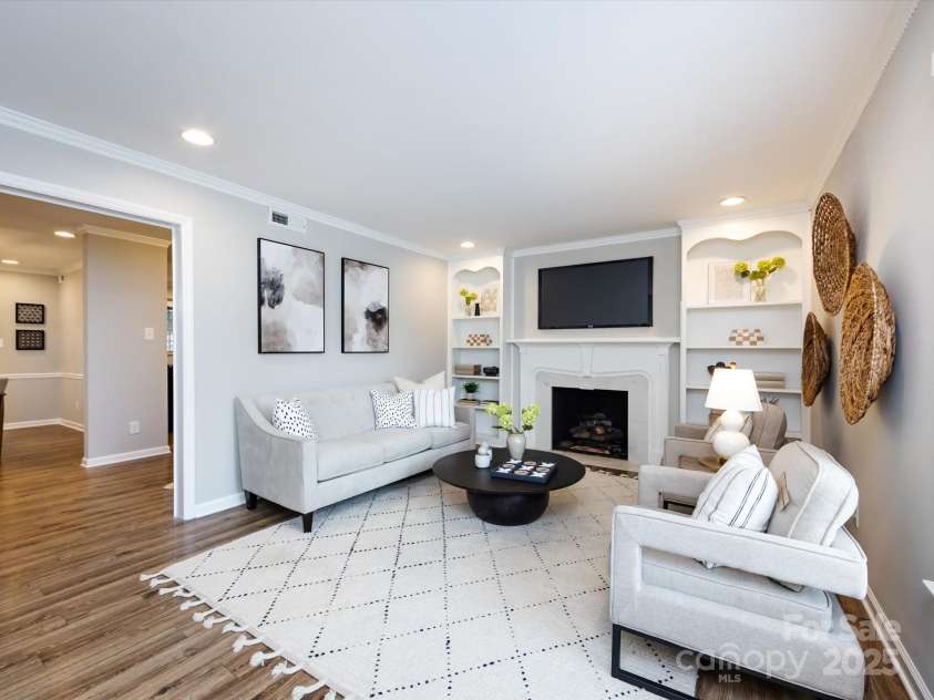 1708 Roxborough Road, Charlotte, NC 28211.  MLS# CAR4271759, YatesRealty ID 21279. Spacious living room with gas fireplace flanked by built ins.