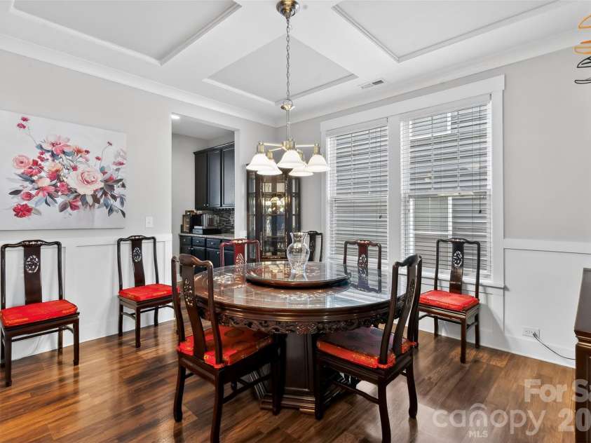 10012 Michael Crossing Drive, Charlotte, NC 28213.  MLS# CAR4358230, YatesRealty ID 21283. Formal dining room featuring an elegant coffered ceiling