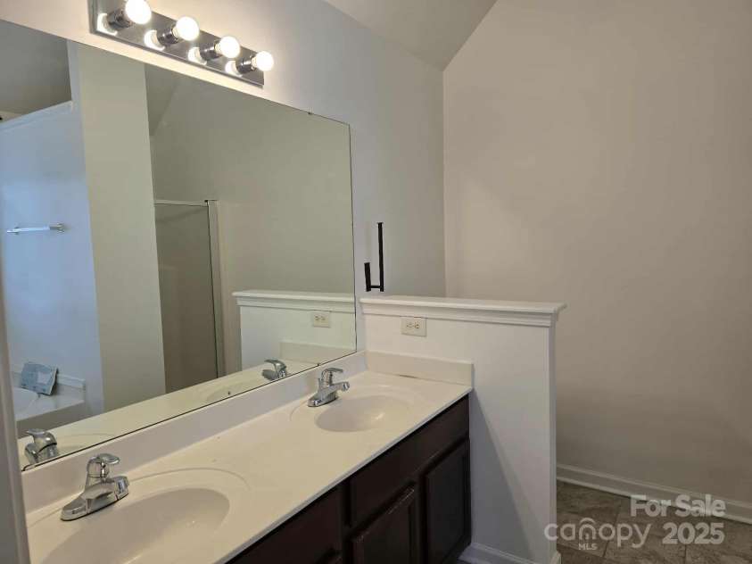 5713 Falkirk Lane, Matthews, NC 28104.  MLS# CAR4243760, YatesRealty ID 21287. Primary Bath