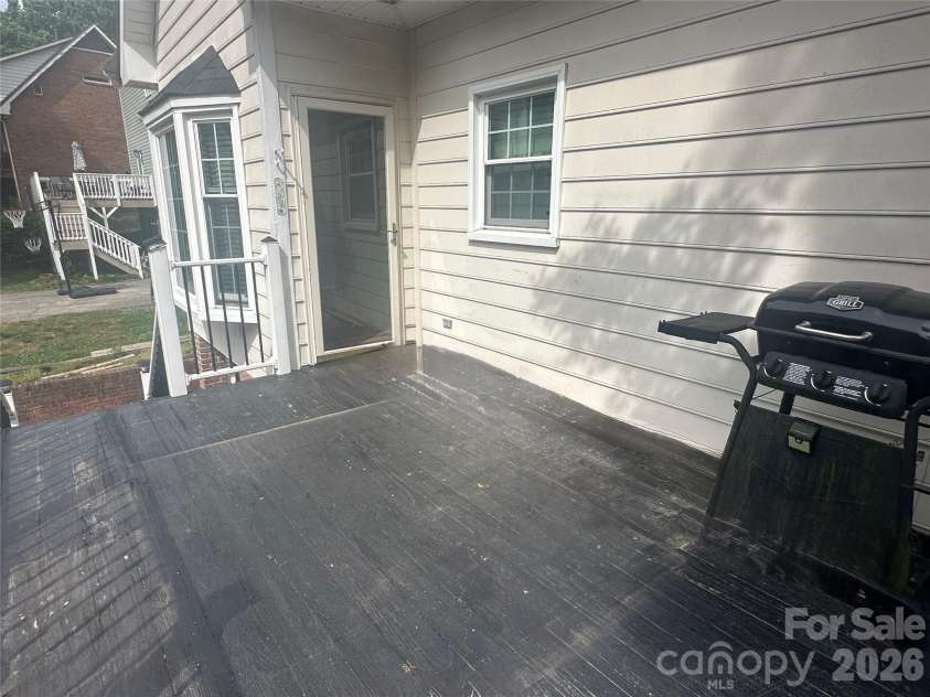 4116 Moss Brook Drive, Winston Salem, NC 27127.  MLS# CAR4380282, YatesRealty ID 21288. Back deck off dining room