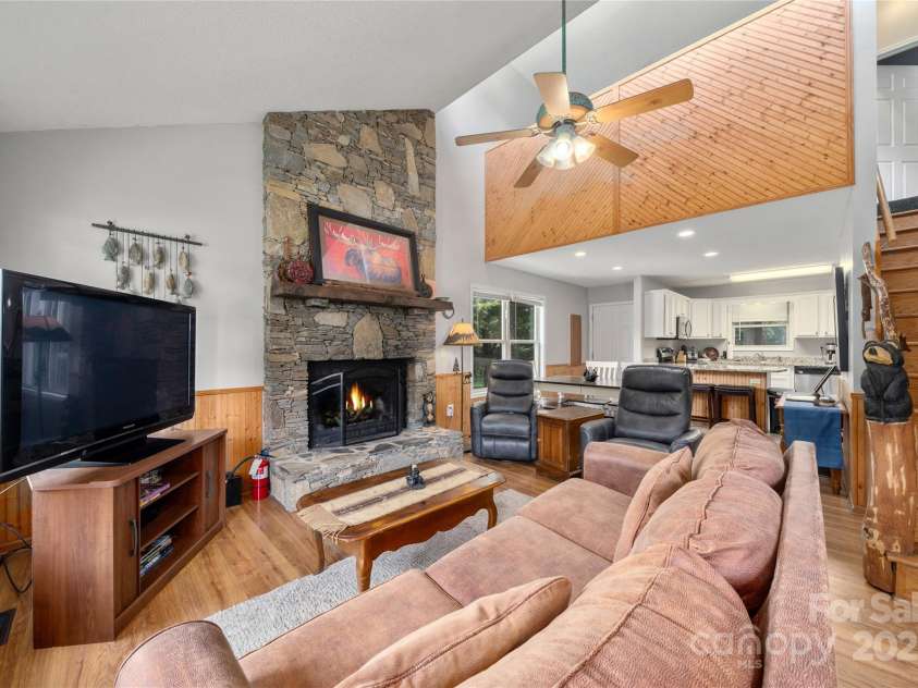 84 Indian Trace, Maggie Valley, NC 28751.  MLS# CAR4272235, YatesRealty ID 21289. 2-Story stone fireplace is gorgeous