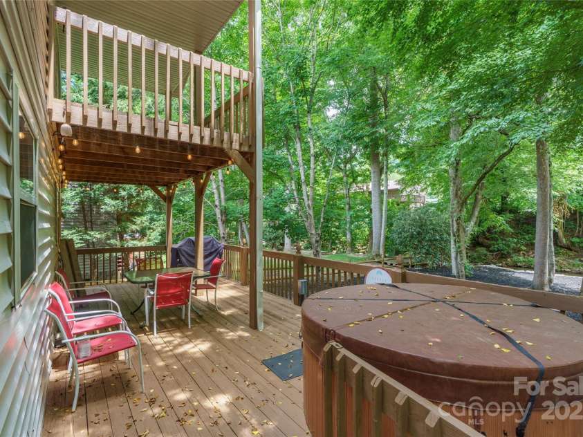 84 Indian Trace, Maggie Valley, NC 28751.  MLS# CAR4272235, YatesRealty ID 21289. Outdoor Living overlooking the Creek