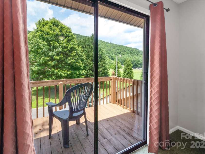 84 Indian Trace, Maggie Valley, NC 28751.  MLS# CAR4272235, YatesRealty ID 21289. Private balcony for upper main level bedroom