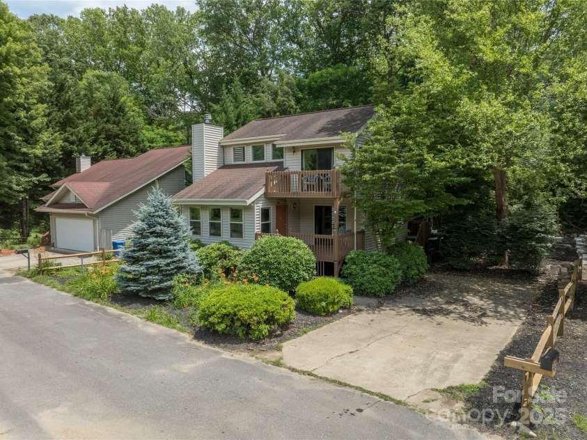 84 Indian Trace, Maggie Valley, NC 28751.  MLS# CAR4272235, YatesRealty ID 21289. Wide level parking beside the hosue