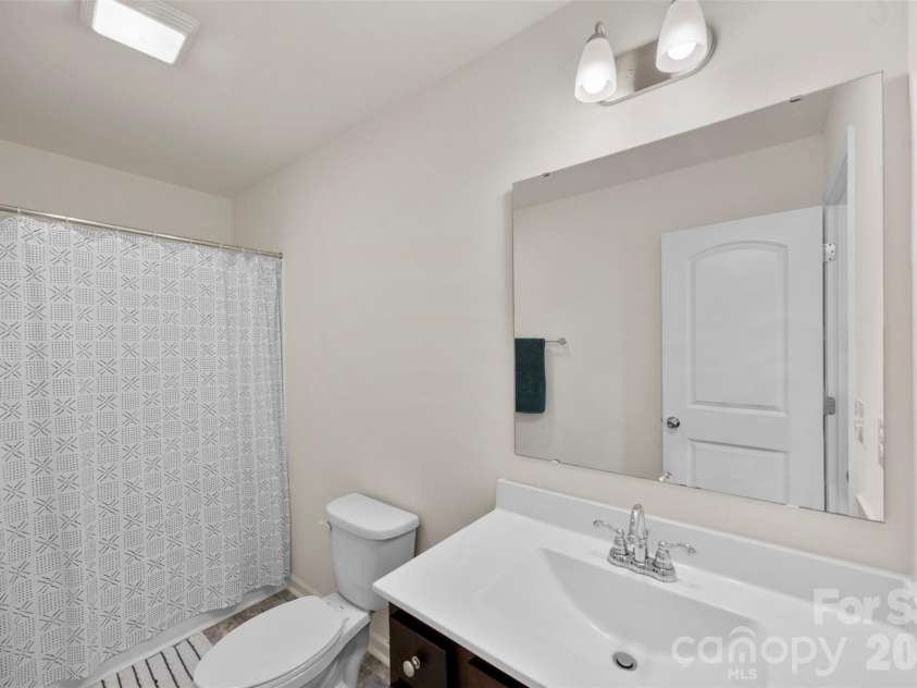 717 Lexington Drive, Albemarle, NC 28001.  MLS# CAR4345706, YatesRealty ID 21291. Hallway bathroom
