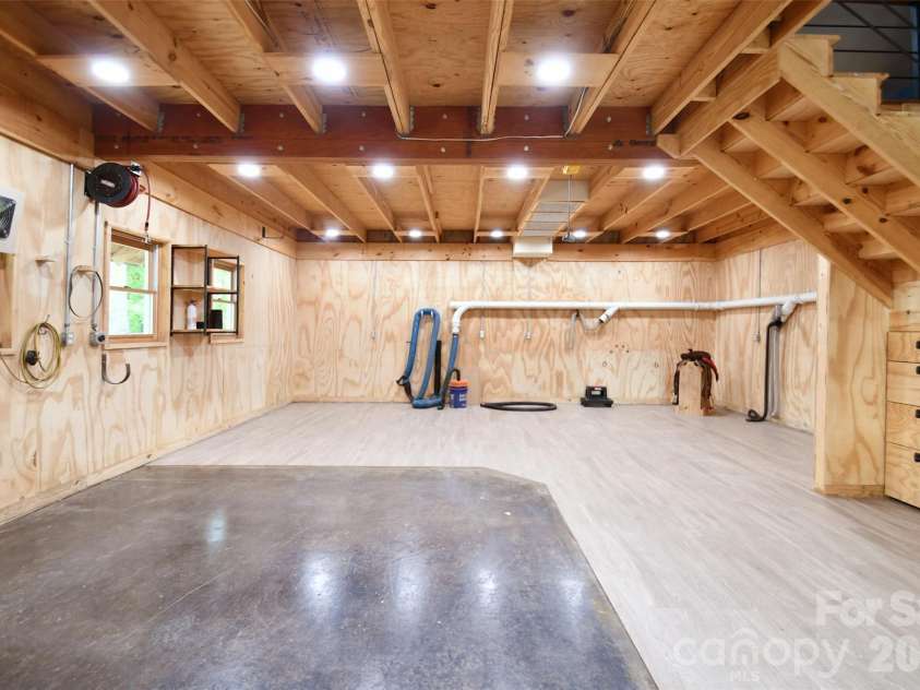 4484 Ranchway Drive, Concord, NC 28027.  MLS# CAR4375185, YatesRealty ID 21305. Expansive main-level workspace with durable flooring, abundant lighting, and built-in ventilation, ideal for woodworking or hobby use