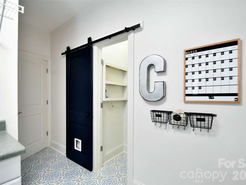 4484 Ranchway Drive, Concord, NC 28027.  MLS# CAR4375185, YatesRealty ID 21305. Functional mudroom with custom built-ins, sliding barn door, and organization space
