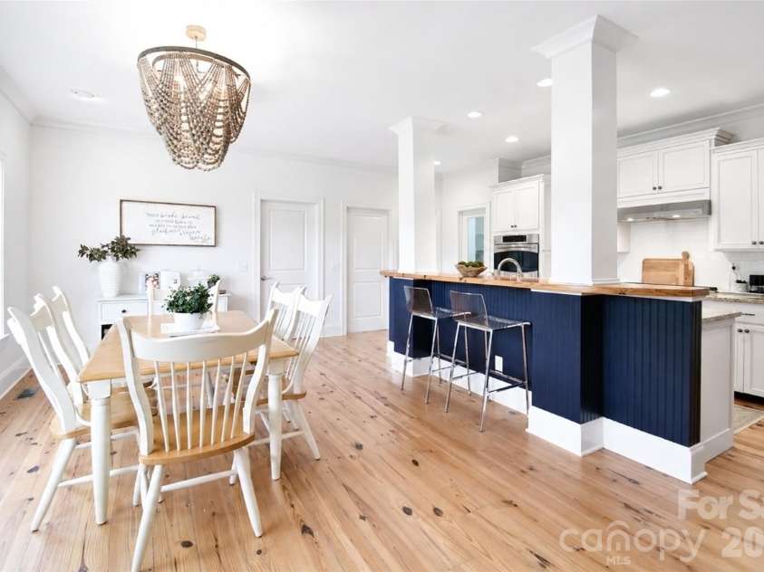 4484 Ranchway Drive, Concord, NC 28027.  MLS# CAR4375185, YatesRealty ID 21305. Open dining area flowing into kitchen with large island