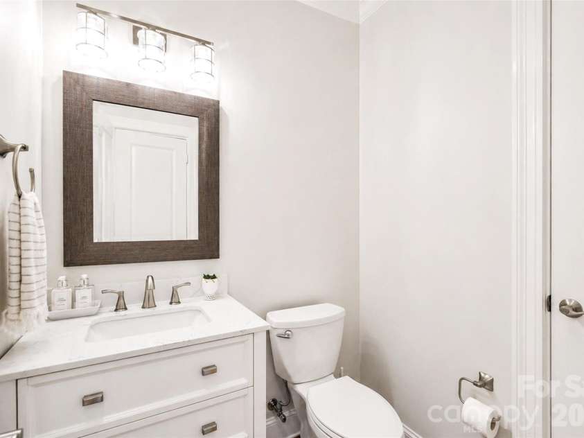 4484 Ranchway Drive, Concord, NC 28027.  MLS# CAR4375185, YatesRealty ID 21305. Stylish half bath with updated vanity, modern lighting, and neutral finishes