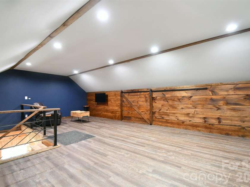 4484 Ranchway Drive, Concord, NC 28027.  MLS# CAR4375185, YatesRealty ID 21305. Versatile second-level space perfect for office, hobby room, or creative studio overlooking the main workshop