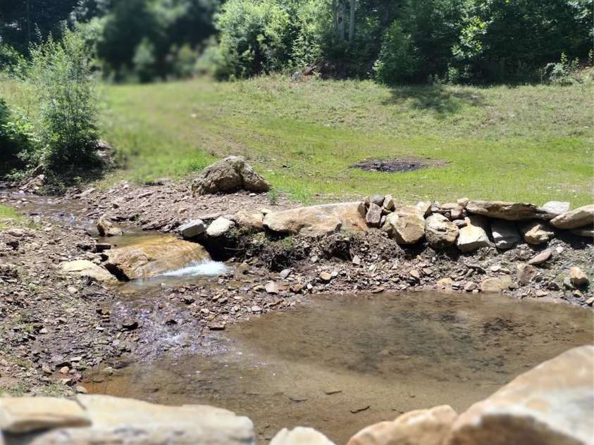 962 Laurel Mountain View Road, Flat Rock, NC 28731.  MLS# CAR4270563, YatesRealty ID 21311. Small pond and creek