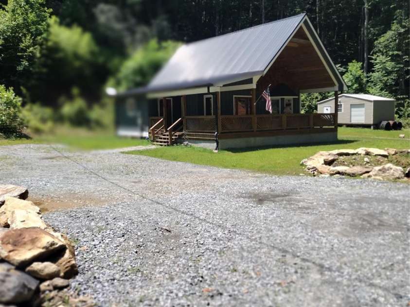 962 Laurel Mountain View Road, Flat Rock, NC 28731.  MLS# CAR4270563, YatesRealty ID 21311. View of home and storage building