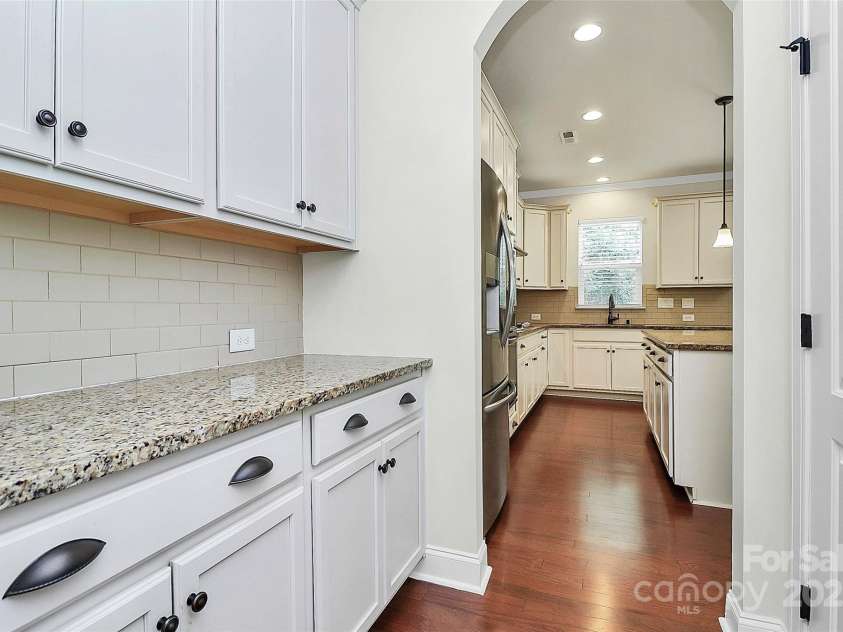 7011 Hyde Park Drive, Indian Trail, NC 28079.  MLS# CAR4268661, YatesRealty ID 21323. Butler pantry between kitchen and dining room for added storage