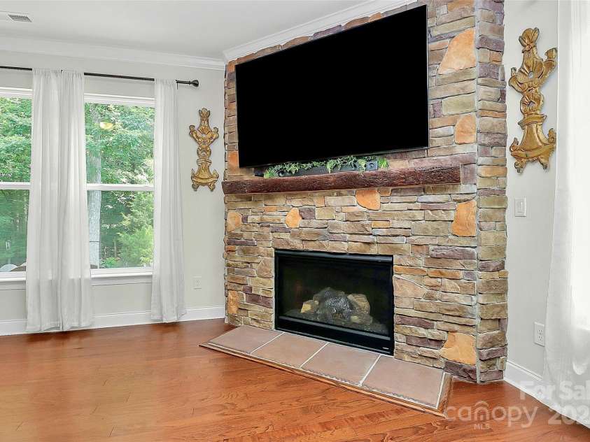7011 Hyde Park Drive, Indian Trail, NC 28079.  MLS# CAR4268661, YatesRealty ID 21323. Stone accent gas log fireplace