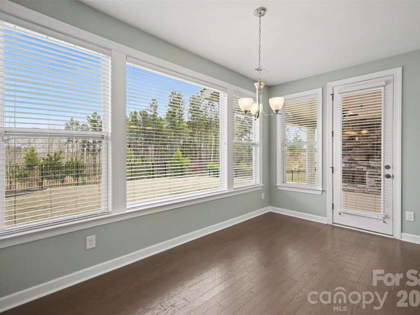 115 Boxelder Road, Clover, SC 29710.  MLS# CAR4364422, YatesRealty ID 21324. Eat in dining area-- this room is generously sized to accommodate a large table and plenty of room for a sideboard.  The large windows make this area so welcoming and overlooks the backyard and hoa owned land