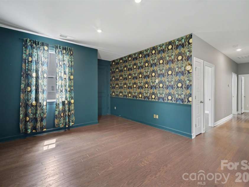 115 Boxelder Road, Clover, SC 29710.  MLS# CAR4364422, YatesRealty ID 21324. Upstairs loft area - this opens onto the upper porch, creating a unique and inviting atmosphere.  There is prefinished hardwood flooring throughout the upstairs- no carpet!