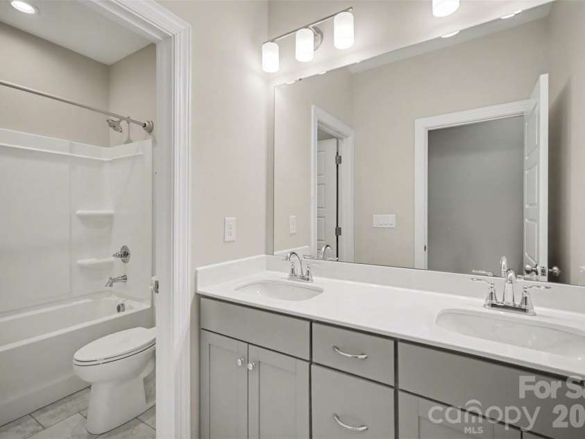 115 Boxelder Road, Clover, SC 29710.  MLS# CAR4364422, YatesRealty ID 21324. Upstairs second full bathroom,  raised vanity with dual sinks and tub/shower combo
