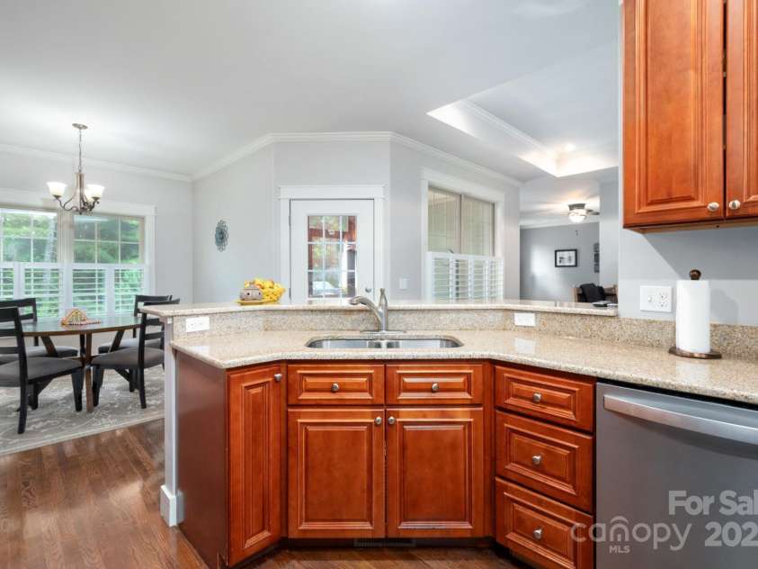 59 Ledgestone Drive, Fairview, NC 28730.  MLS# CAR4272248, YatesRealty ID 21340. Kitchen connects to both eat-in and formal dining