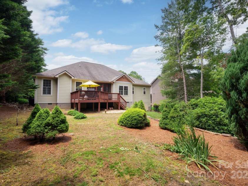 59 Ledgestone Drive, Fairview, NC 28730.  MLS# CAR4272248, YatesRealty ID 21340. Level fenced rear yard with mature landscaping and peekaboo views