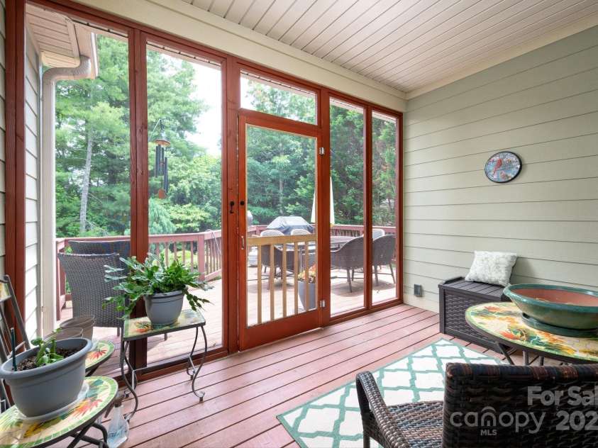 59 Ledgestone Drive, Fairview, NC 28730.  MLS# CAR4272248, YatesRealty ID 21340. Lovely screened in porch