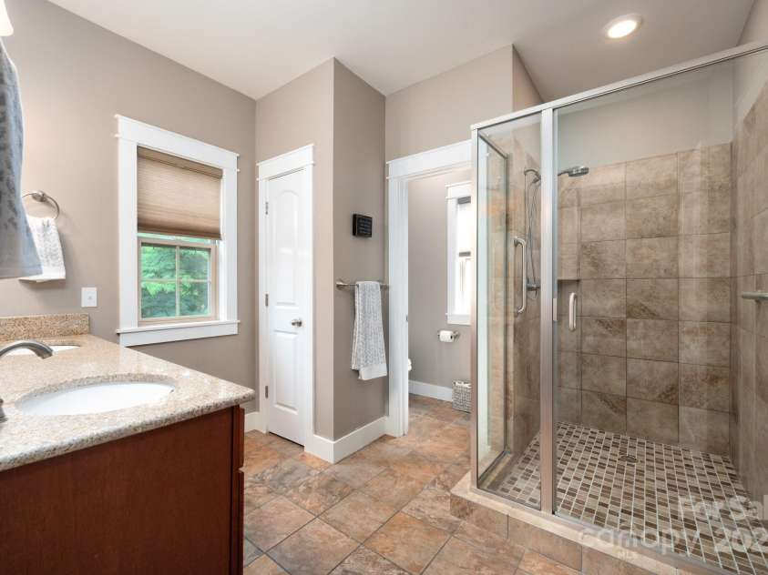 59 Ledgestone Drive, Fairview, NC 28730.  MLS# CAR4272248, YatesRealty ID 21340. Spacious shower and large walk-in closet