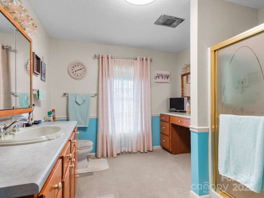 727 Jenkins Valley Road, Alexander, NC 28701.  MLS# CAR4235182, YatesRealty ID 21342. Guest bathroom on main