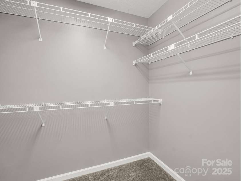 919 Kanuga Road, Hendersonville, NC 28739.  MLS# CAR4243134, YatesRealty ID 21346. Primary walk-in closet has attic access.