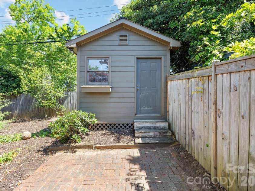 208 Wales Avenue, Charlotte, NC 28209.  MLS# CAR4374743, YatesRealty ID 21348. Storage Shed with Workbench