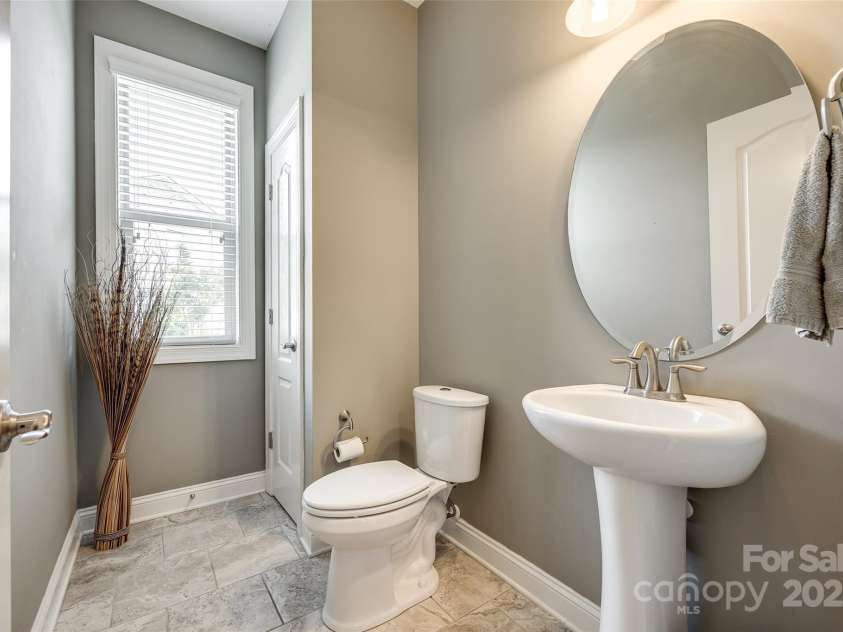 4220 Thames Circle, Fort Mill, SC 29715.  MLS# CAR4269866, YatesRealty ID 21352. A practical half bath downstairs is perfect for guests.